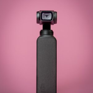 black and gray camera on red background