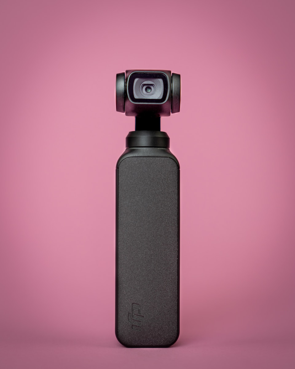 black and gray camera on red background