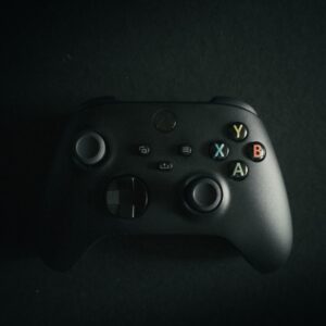 a close up of a controller on a black surface