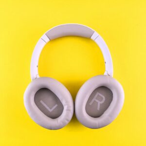 White headphones with l and r indicators on yellow.