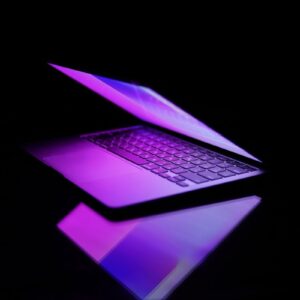 a laptop computer sitting on top of a table